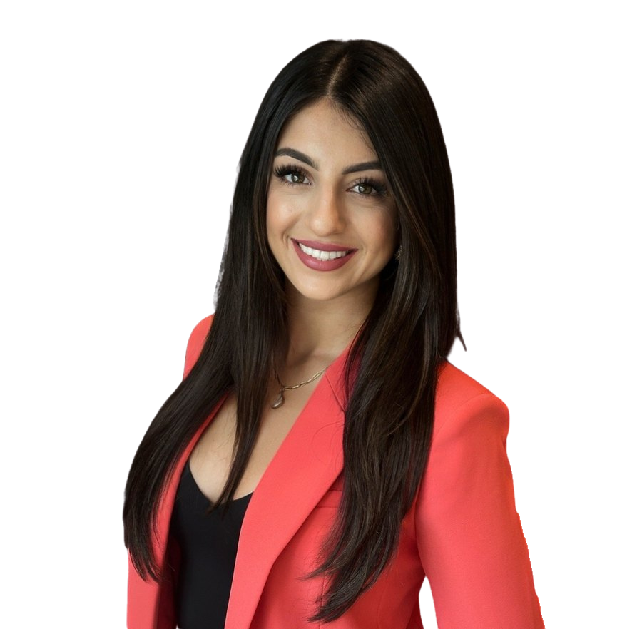 Sarah Sedehi, coastal Southern California REALTOR®, smiling in a coral blazer.